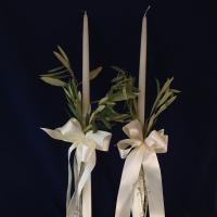 Organic and very Greek.  24 inch wedding candles with satin ribbon and natural olive branches.  Matching party favors or boubounieres made with 7 almonds and organza from Greece.  

Candle set:  $90.00
Party favors: $5.00 each.  Contact us to order.  