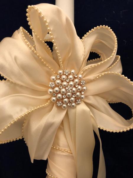 32 Inch Wedding Candle.  Ivory Satin ribbon wrapped along the base of the candle.  Ribbon bow with gold tone crystal and pearl embellishment.  

Price:  $125.

