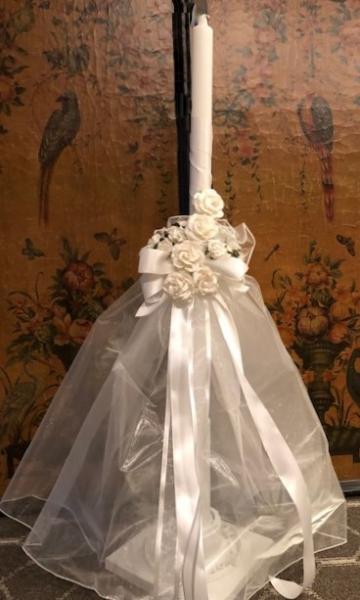 Extra Large wedding candle lambada to adorn the altar.  32 inch white candle wrapped in white satin double face ribbon.  Adorned with organza and white roses.  Bride and Groom candles may be made to match.  
$150.00 each.  Usually ordered in pairs $300.00 plus shipping. 
