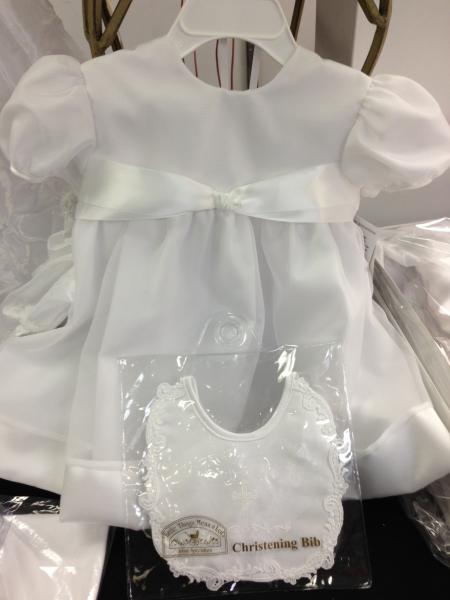 This dress is perfect for the goddaughter who loves simple and elegant.  

Beautiful satin bow and gorgeous fabric. Includes bonnet. 
Sample sale: size 24 months - $69.95