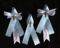 Baby blue and white matyrika with a brass finish cross for a special baby who needs an extra blessing.  Godparents are very special people and we added white bows to their witness pins. 