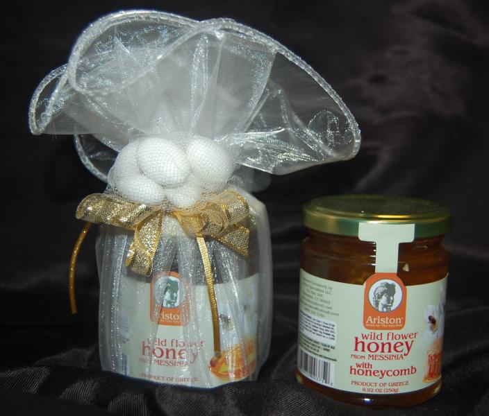 Greek honey jar wrapped in toule with jordan almonds.  A special gift for shower, wedding or baptism guests.  Honey imported from Greece.  $15 each.  May be personalized with ribbon.  