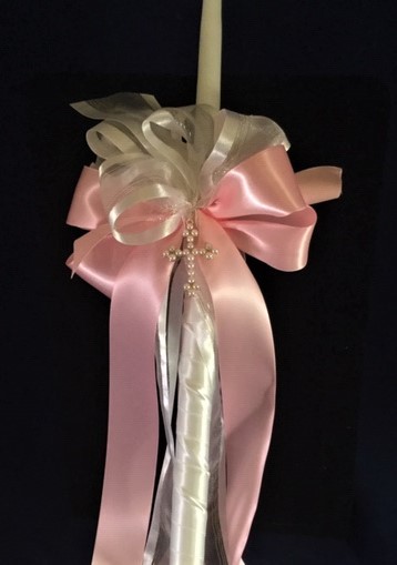 Pink and white ribbons adorned by a gold and pearl cross.  Matching accessory candles available. 

$45.00 24 inch candle
$95.00 32 inch lambada
$18.00 15 inch accessory child candle 