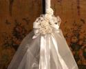 Extra Large wedding candle lambada to adorn the altar.  32 inch white candle wrapped in white satin double face ribbon.  Adorned with organza and white roses.  Bride and Groom candles may be made to match.  
$150.00 each.  Usually ordered in pairs $300.00 plus shipping. 
