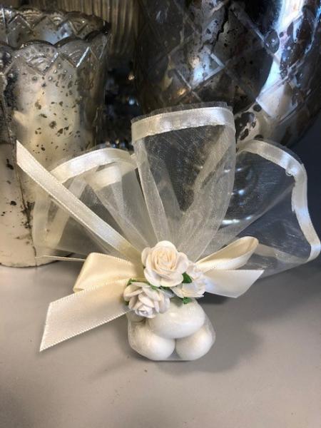 Three beatiful flowers wrapped with ribbon around organza with satin trip.  5 Jordan almonds, koufeta.  Boubenieres can be personalized with special cards that describe the tradition of koufeta.  $4.25 each.  