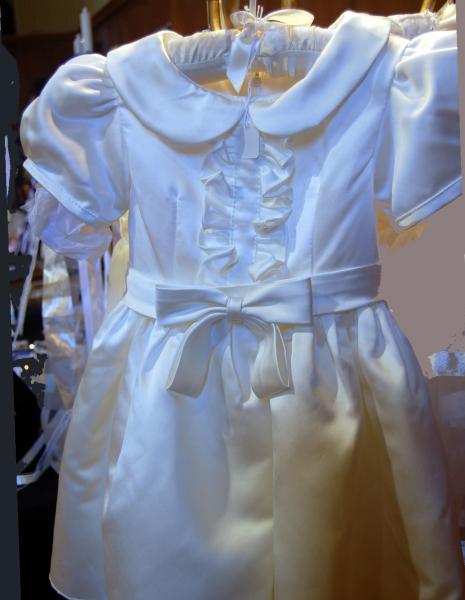 A one of a kind that has a light ivory hue in satin.  Perfect for any occasion. 

This one $75.
