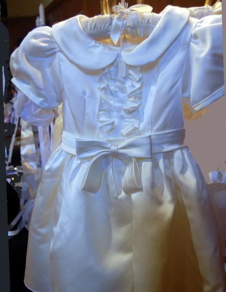 A one of a kind that has a light ivory hue in satin.  Perfect for any occasion. 

This one $75.
