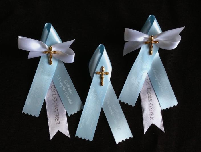 Baby blue and white matyrika with a brass finish cross for a special baby who needs an extra blessing.  Godparents are very special people and we added white bows to their witness pins. 