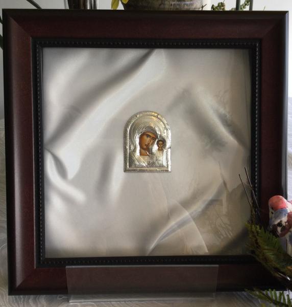 Display and preserve wedding Stefana. This stefanothiki is clearly a beautiful high-quality keepsake that will always be in style. Rich Mahogany frame. The inside, is shown with high quality white satin and a beautiful silver icon. This wedding crown case opens and closes easily with a magnetic catch. Outside dimensions are approximately 11 1/4" x 11 1/4."
Great Gifts from friends and family. 

Out of stock contact us to special order. 

Gifts for the Bride and Groom to complete their Iconastasis.