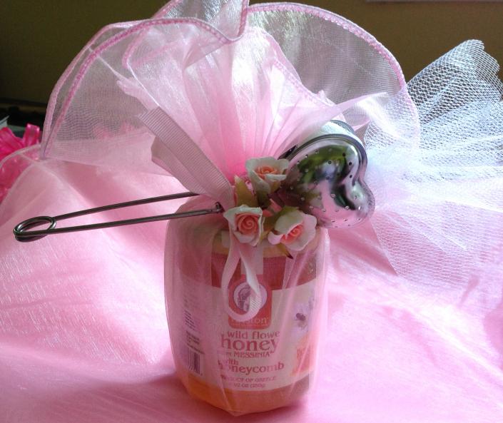 This gift item coordinates with a beautify flower or butterfly decorated baptismal candle.  Tea infuser is perfect for chamomile tea.  The koufeta peek out of the silver heart shaped tea infuser.  Guests love the practicality of this party favor. 