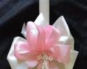 White 24 inch candle
Silver coated cross with just a bit of bling
Pink and white satin ribbon
Nice ribbon wrap

$45 each plus shipping