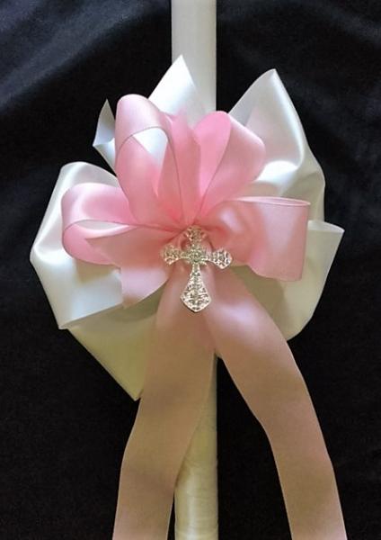 White 24 inch candle
Silver coated cross with just a bit of bling
Pink and white satin ribbon
Nice ribbon wrap

$45 each plus shipping