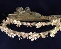This set comes in white or ivory.  Features ceramic stefanotis flowers with with a bit of bling in the center.  Small leaves, pearl spray embellishments and rice beads cascade throughout.  See online store. $175

This is not available, we hope to have more in by April 2022. 