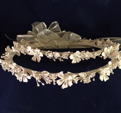 This set comes in white or ivory.  Features ceramic stefanotis flowers with with a bit of bling in the center.  Small leaves, pearl spray embellishments and rice beads cascade throughout.  See online store. $175

This is not available, we hope to have more in by April 2022. 